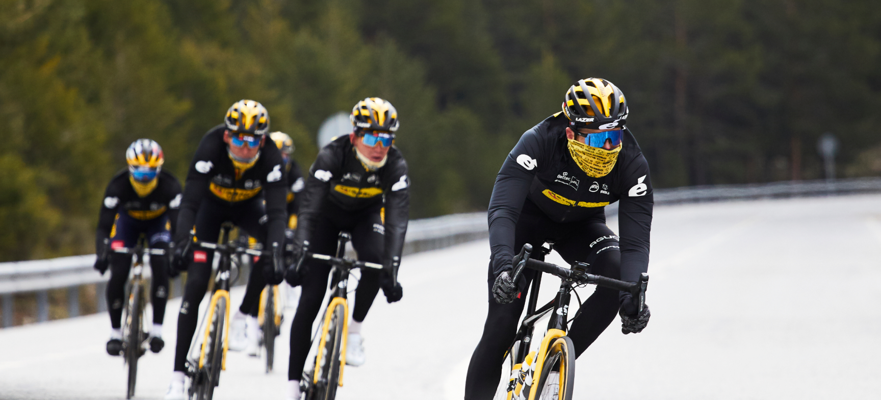 Five Team Jumbo-Visma riders riding in winter conditions