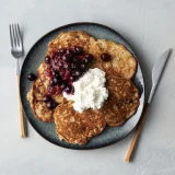 Oatmeal banana pancake with red fruit and cottage cheese