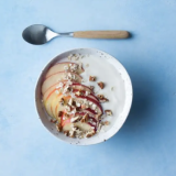 Plant-based variation on yogurt with oatmeal, apple and pecan nuts
