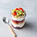 Summer glass with yoghurt with kiwi and strawberry