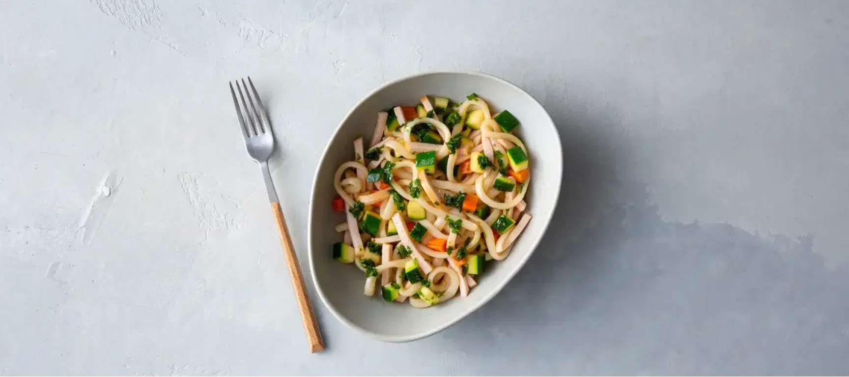 Udon noodles with chicken, carrot and parsley oil